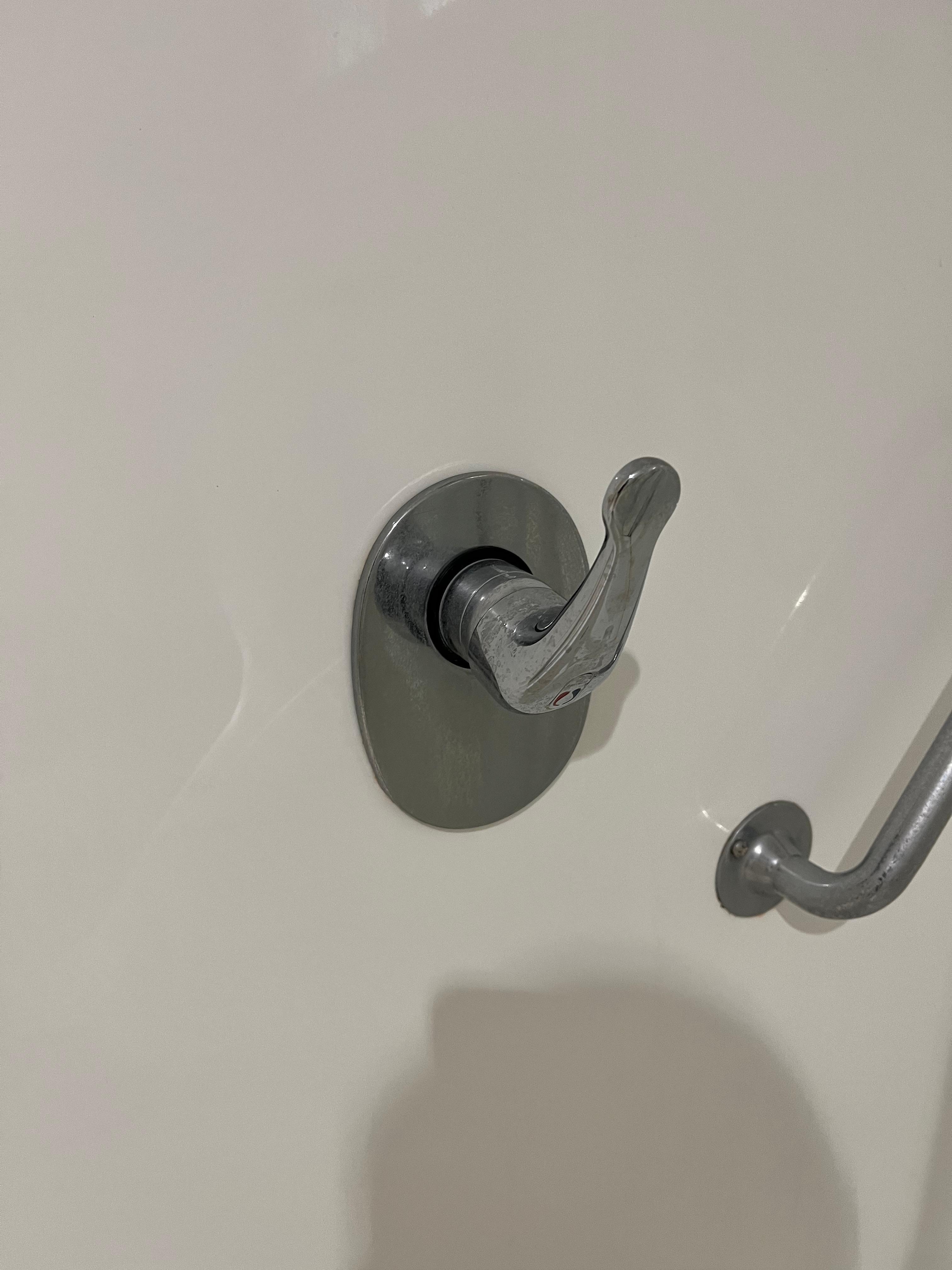 Bathroom shower handle turns 360 degrees and was difficult to use.