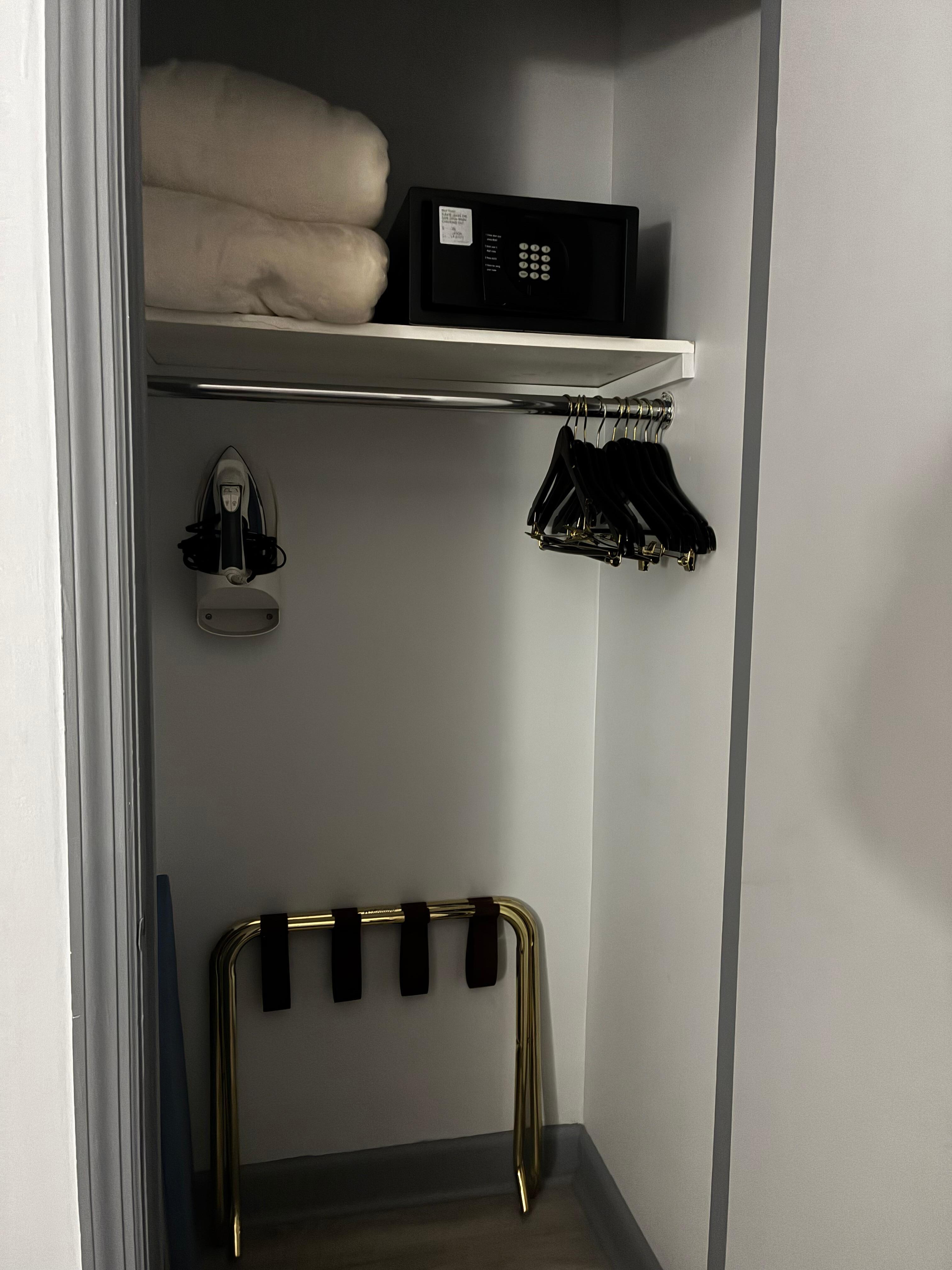 Closet with safe. Spacious for hanging coats.