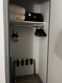 Closet with safe. Spacious for hanging coats.