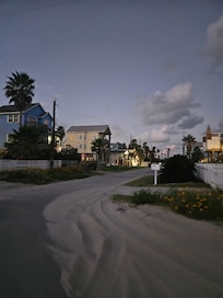 View walking back from beach to house. The yellow house is the rental.