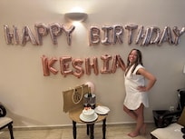 Some Birthday decorations, cake, bottle set by the staff.