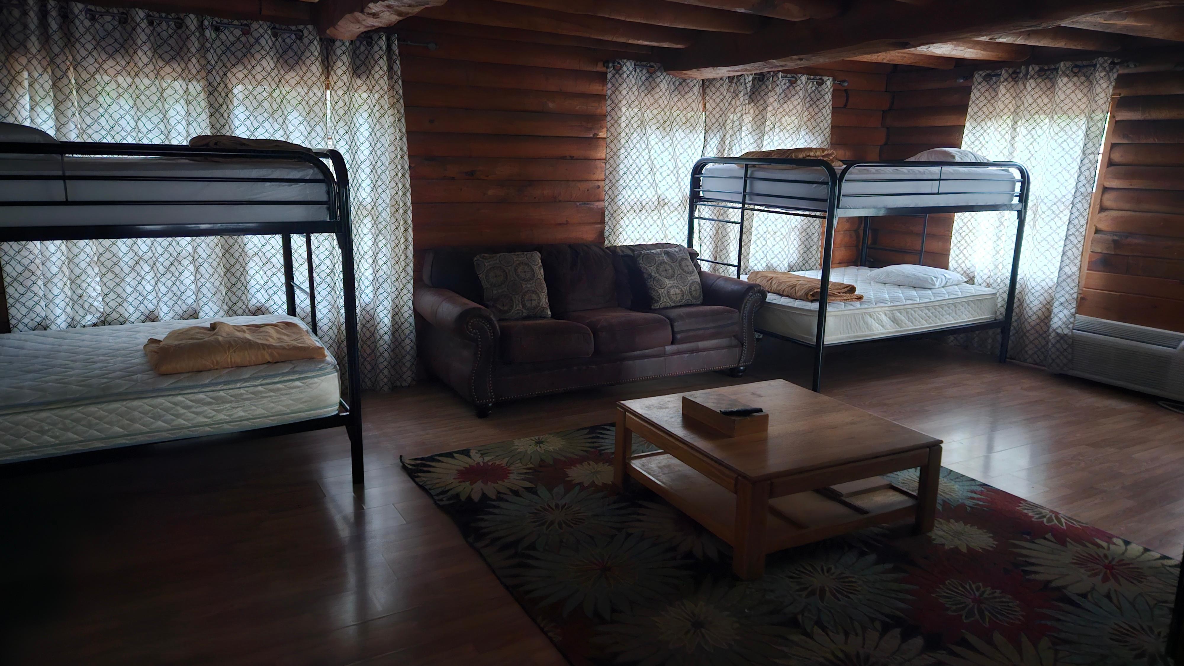 4 bunk beds with the least amount of spider webs downstairs.  3 bedroom upstairs..too many spiders up there