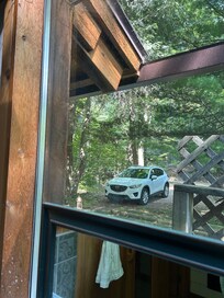 Other home and path access in direct view of bathroom with no privacy shades available