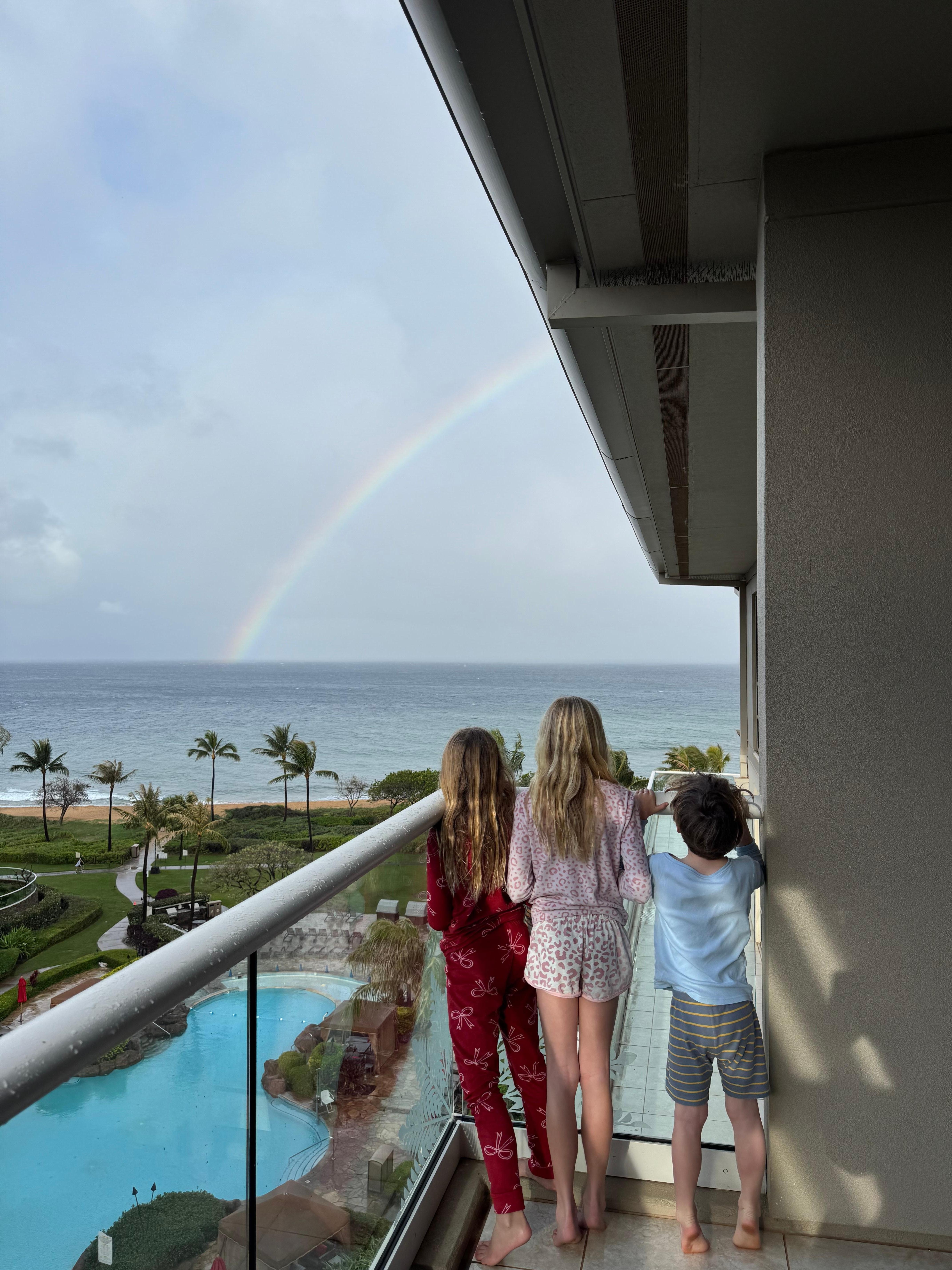 Kids whale watching and admiring the rainbow 