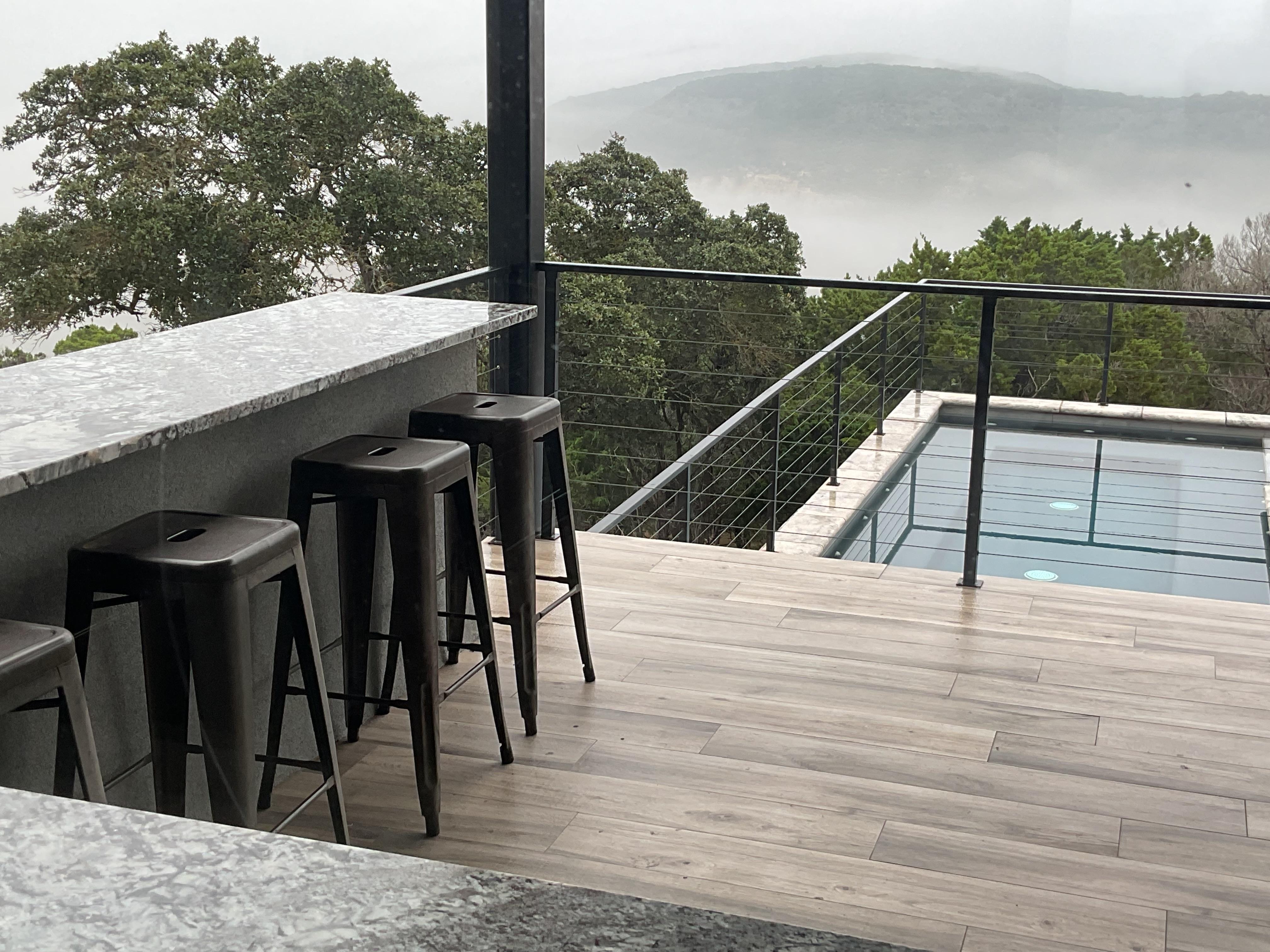 Serene vistas and superb optics from the interior to the outer bar and grill deck, just above the 20 person spa