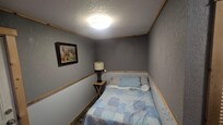 tiny bedroom with no window view of the lake