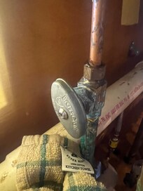 Hot water pipe under kitchen sink