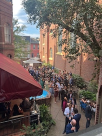 A view of a wedding pre-event in the back courtyard