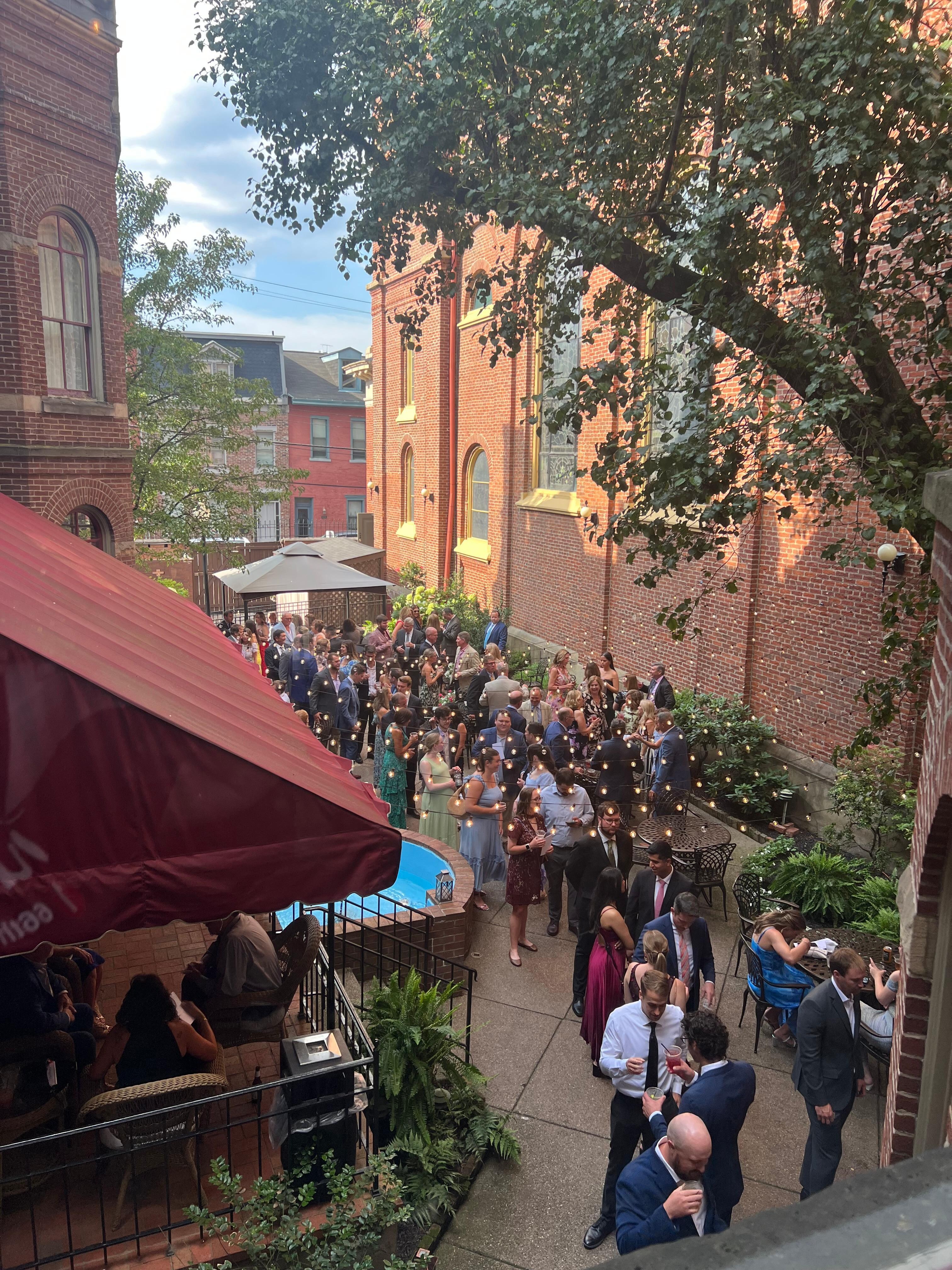 A view of a wedding pre-event in the back courtyard