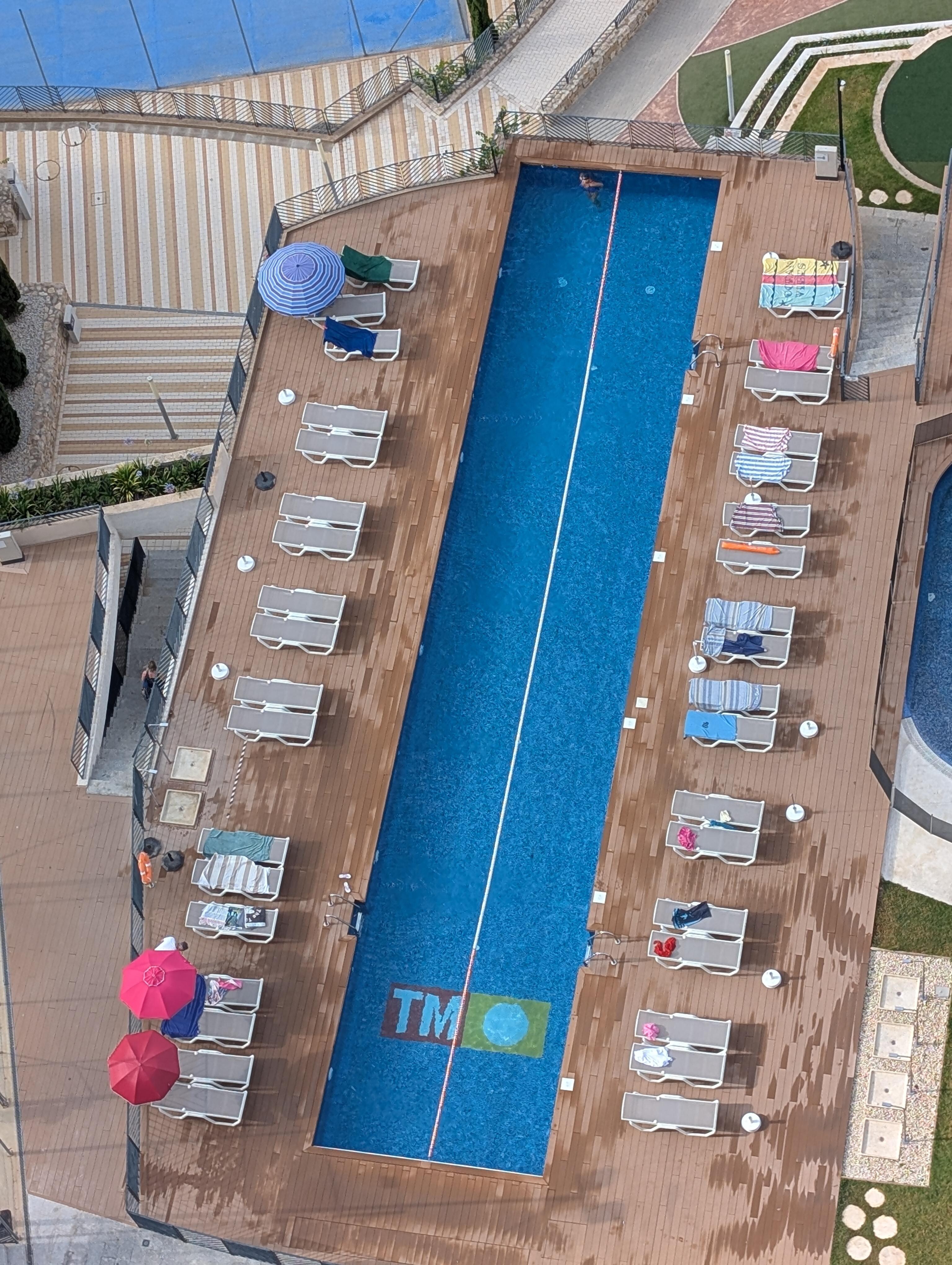 Swimming lane pool, Sunbeds reserved early morning 