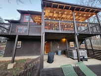 Back of cabin with hot tub