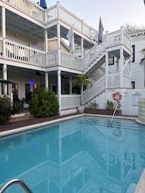 To the left is the entrance to where the breakfast and coffee area is outdoor seating at the rail