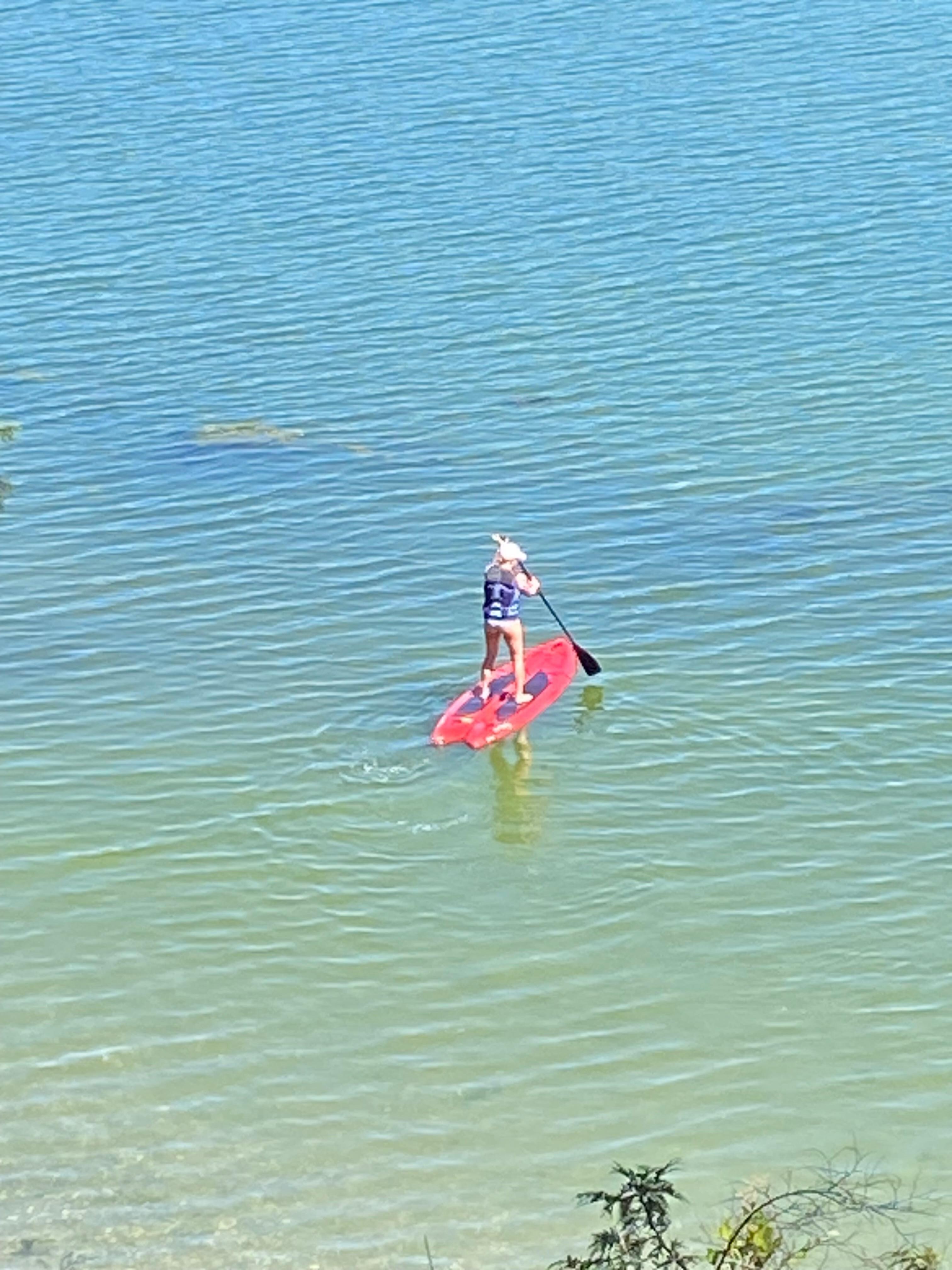 Paddle boat in front of property