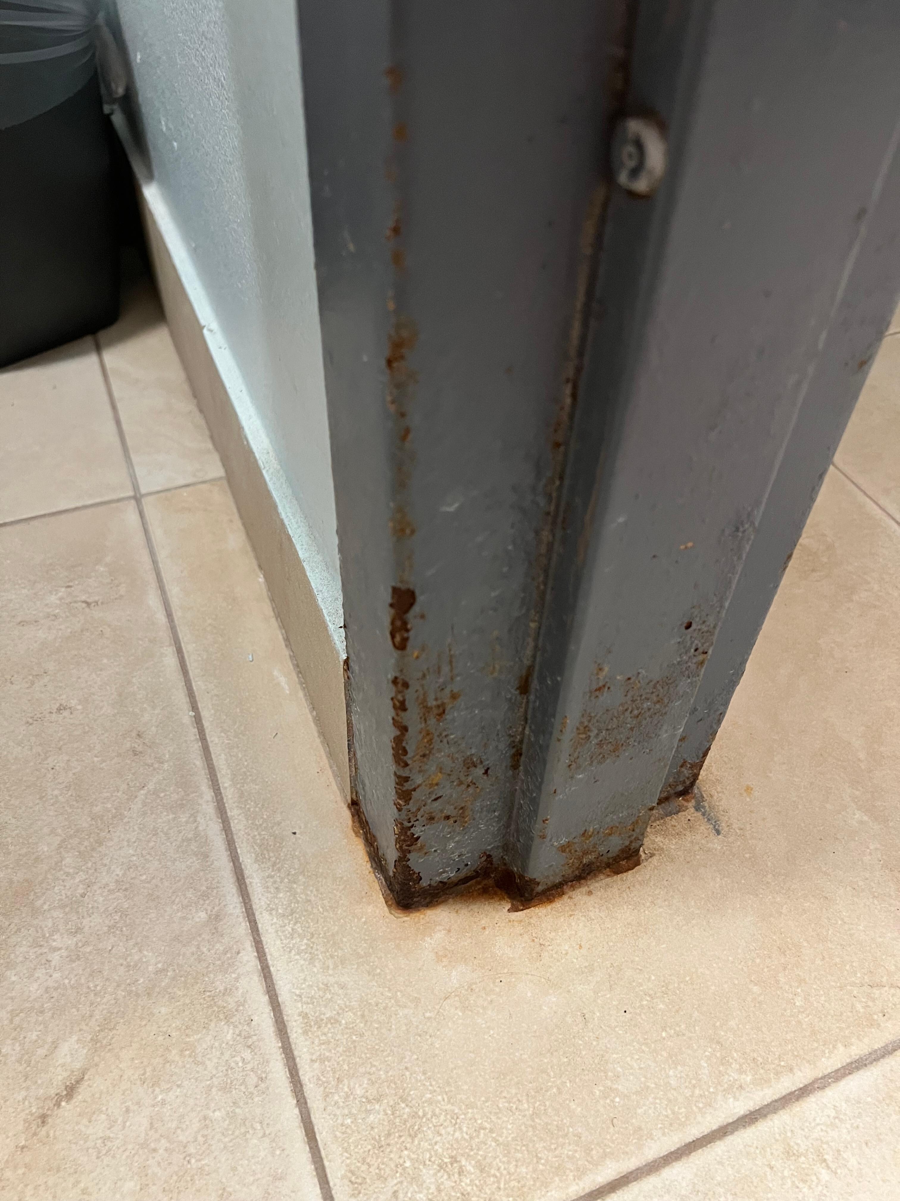 Rust on bathroom door frame/door