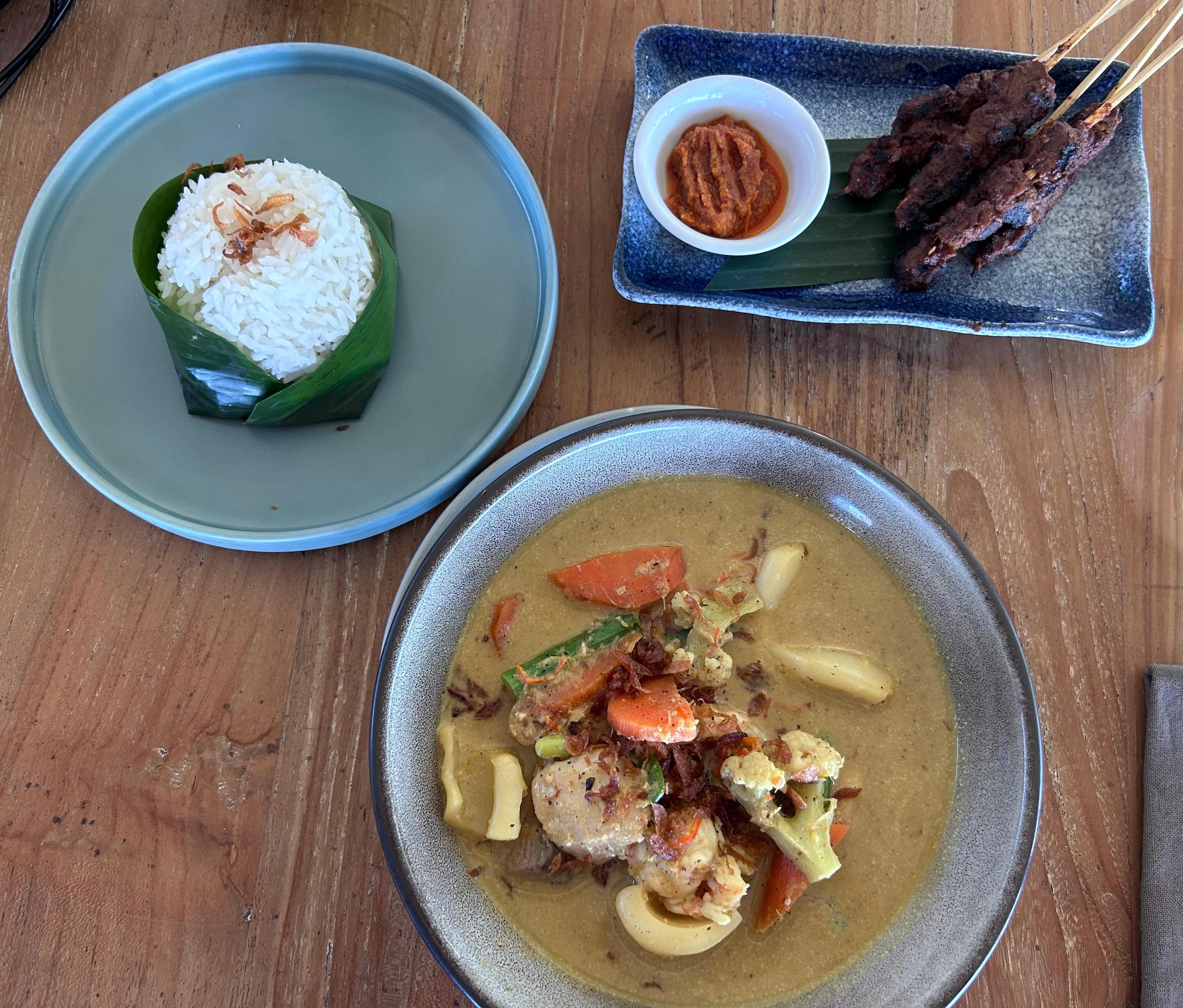 Beef satay and sea food curry
