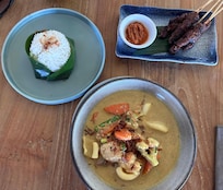 Beef satay and sea food curry