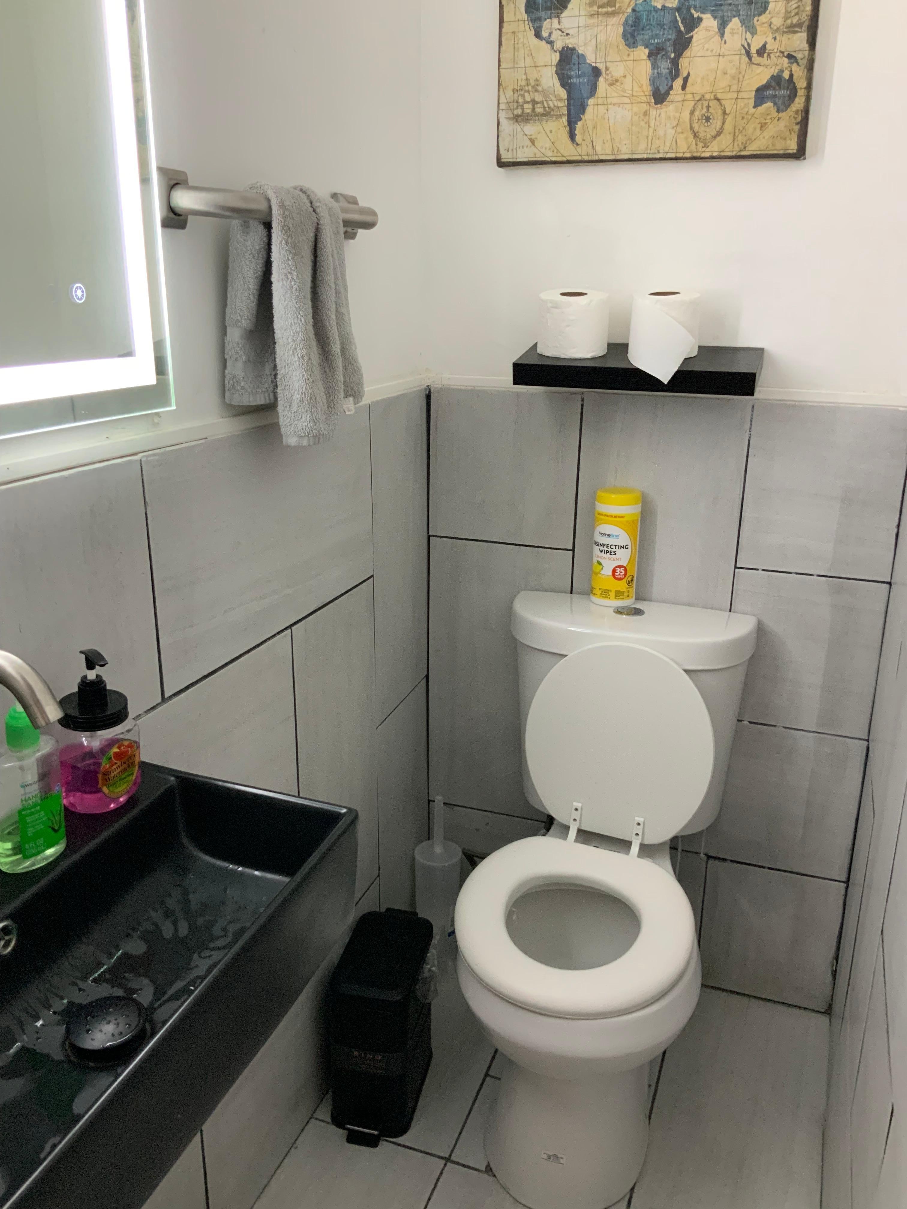 TP needs a wall hanging area or a stand. Shelf only helpful for extra rolls. Can’t reach once seated. 