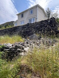 The house from the road below