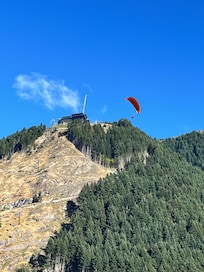 To the right from the patio is Skyline Queenstown, accessed by the gondola and paragliders which landed at the athletic fields nearby.
