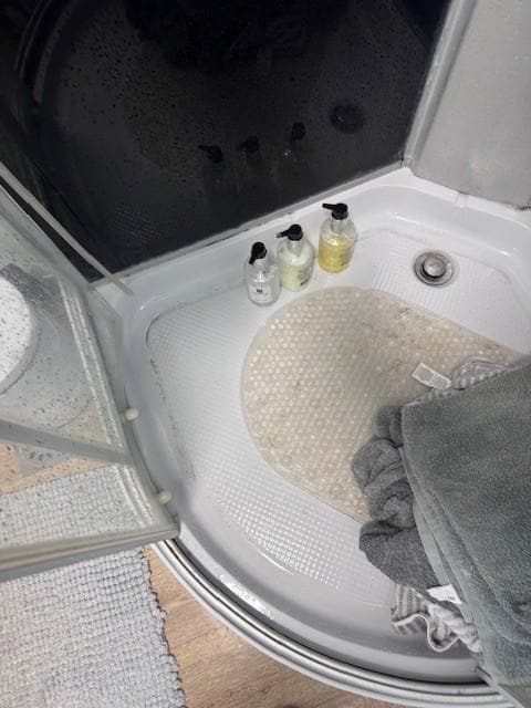 Had to store shower supplies on shower floor.