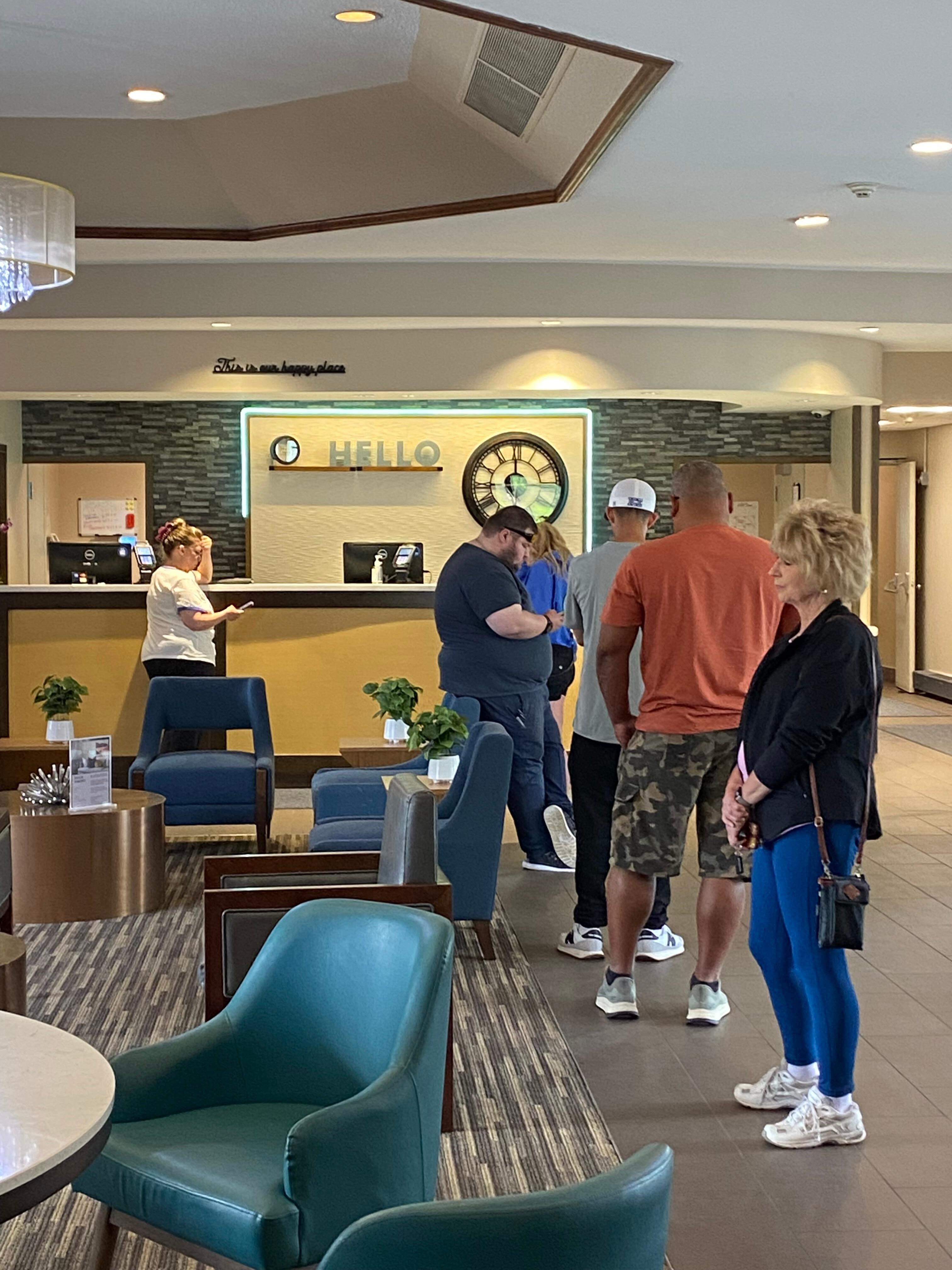 People waiting for hours to check in.  No back up manual check in available.
