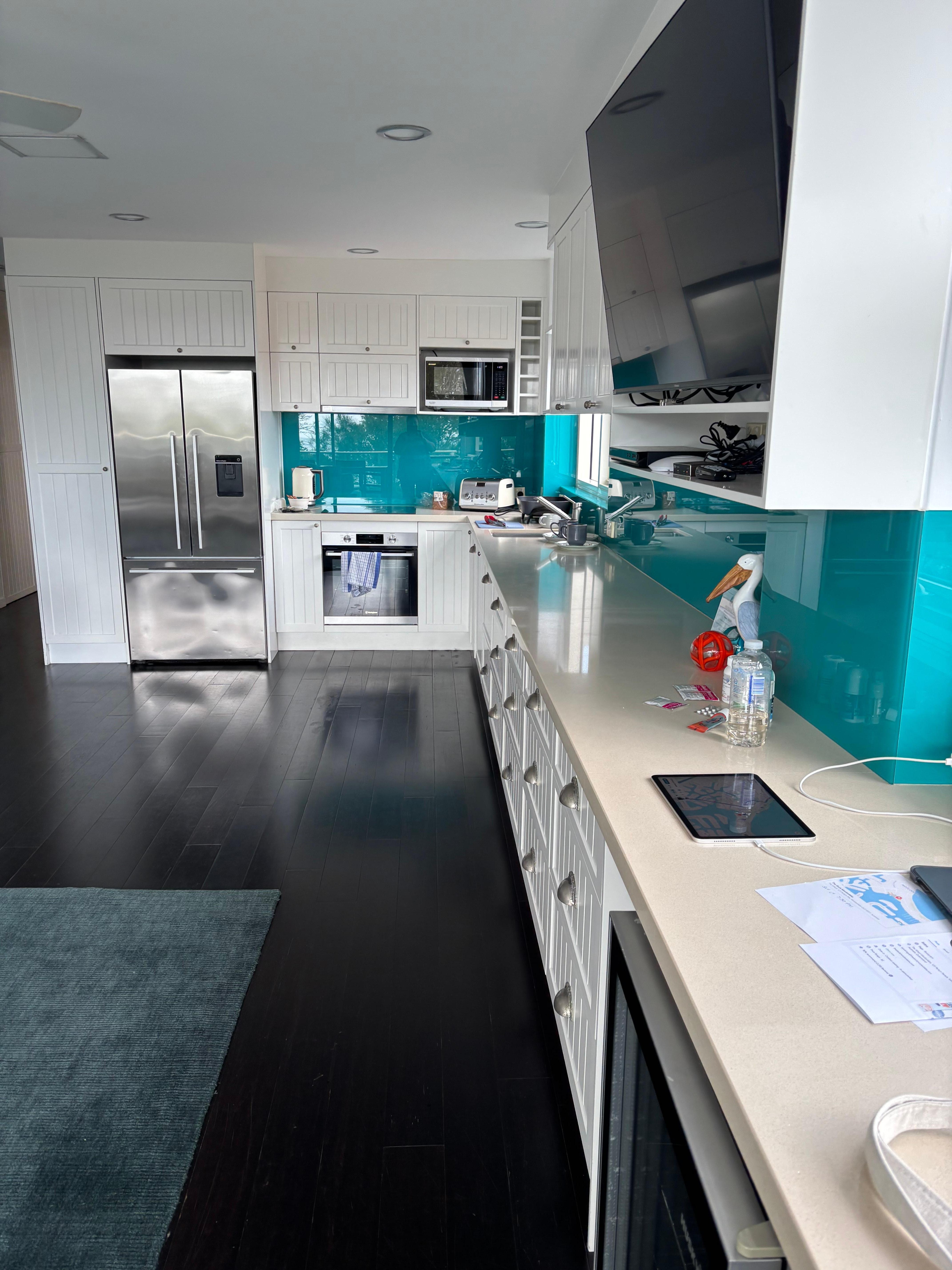 Long view of the kitchen with the ultra-modern unusable stove.  