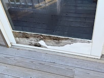 Patio door starting to rot out. Another main patio door was completely missing the weatherstrip between the door panels.