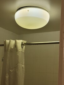 Water dripping down from bathroom light! Yikes!