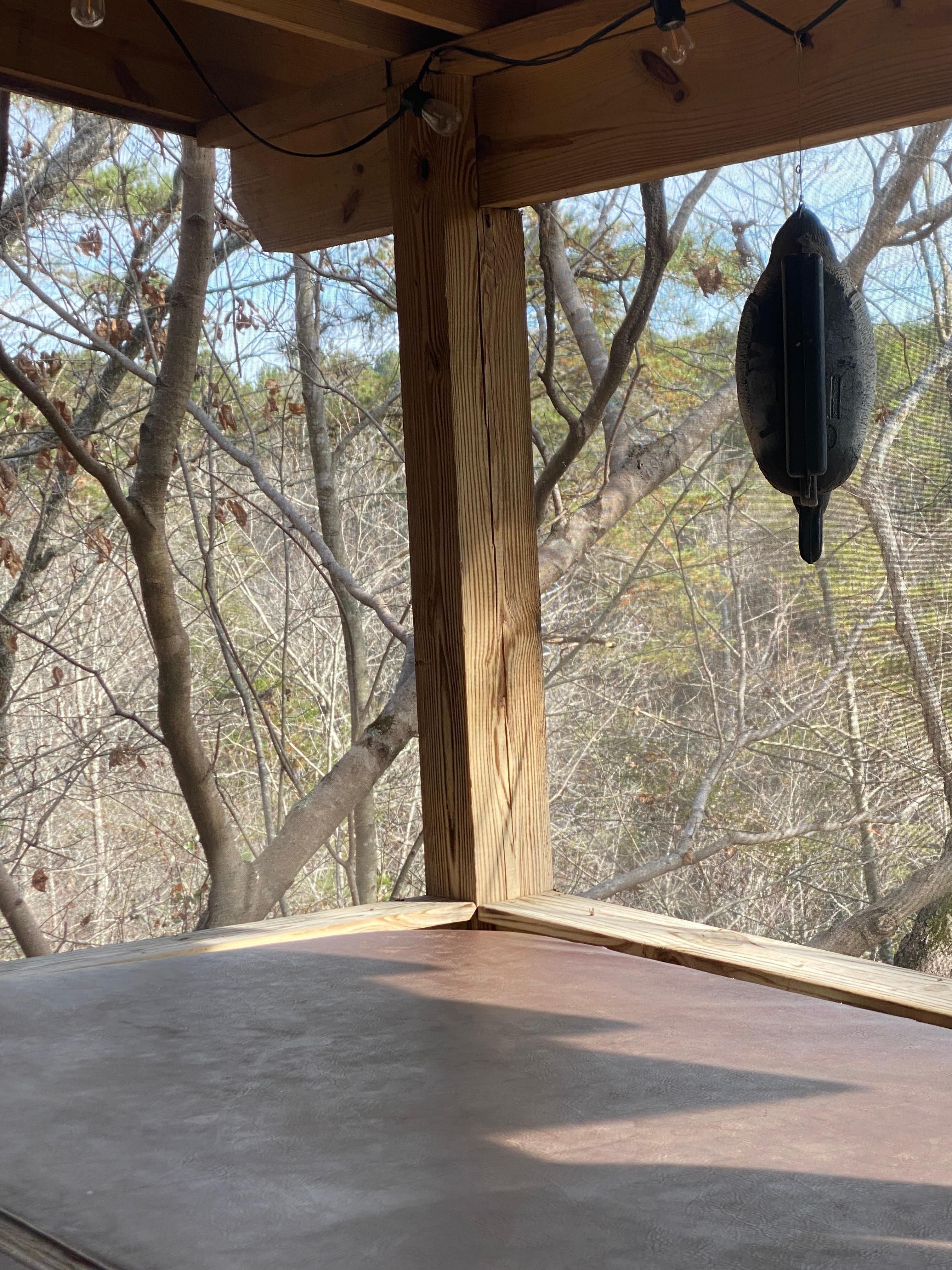 Screened back deck with hot tub.  