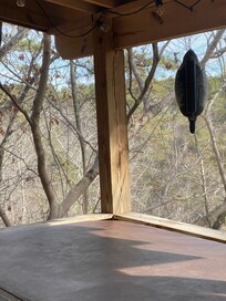 Screened back deck with hot tub.