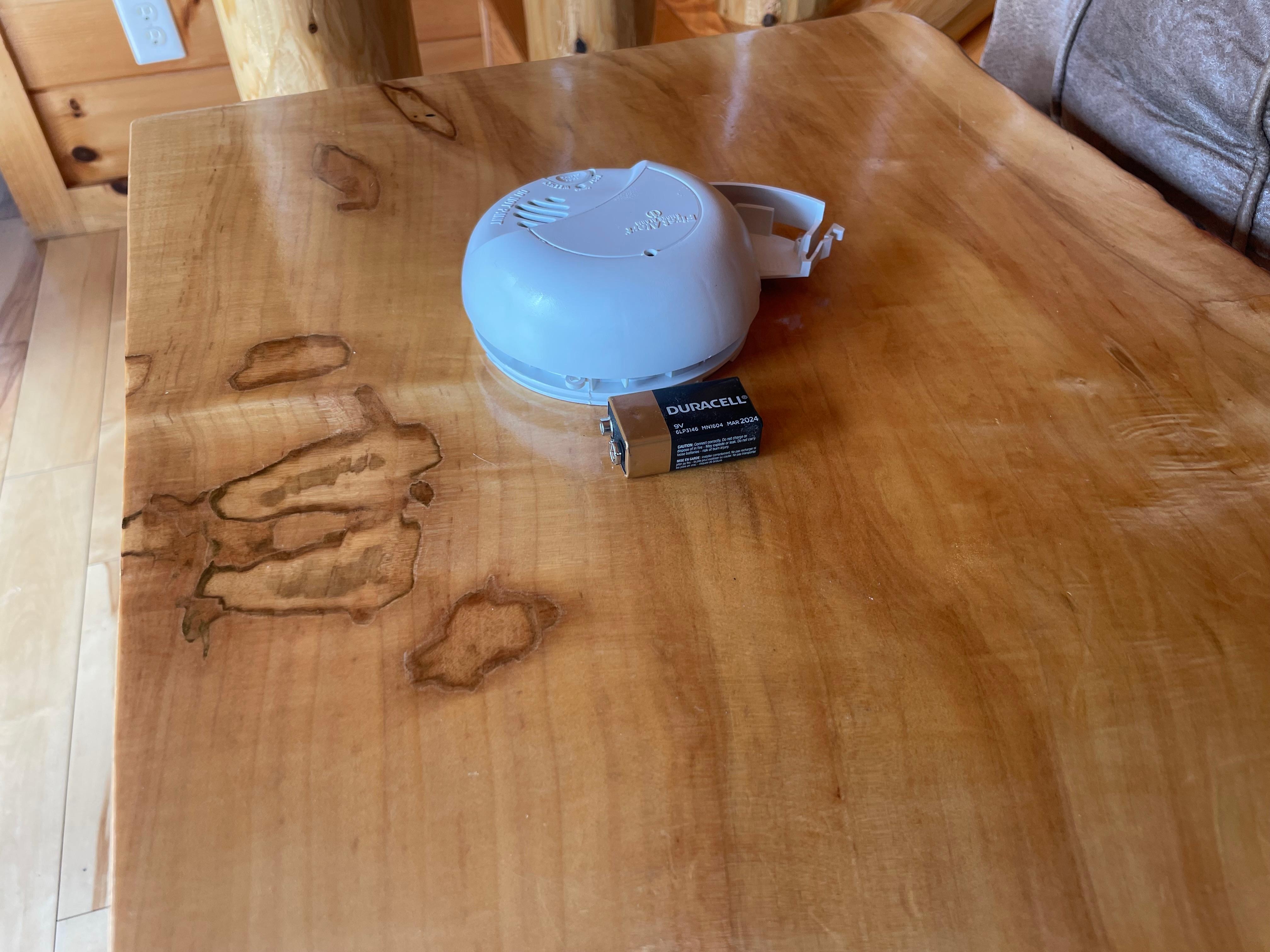 We had to climb up and take the smoke detector down to remove the battery to keep it from chirping.