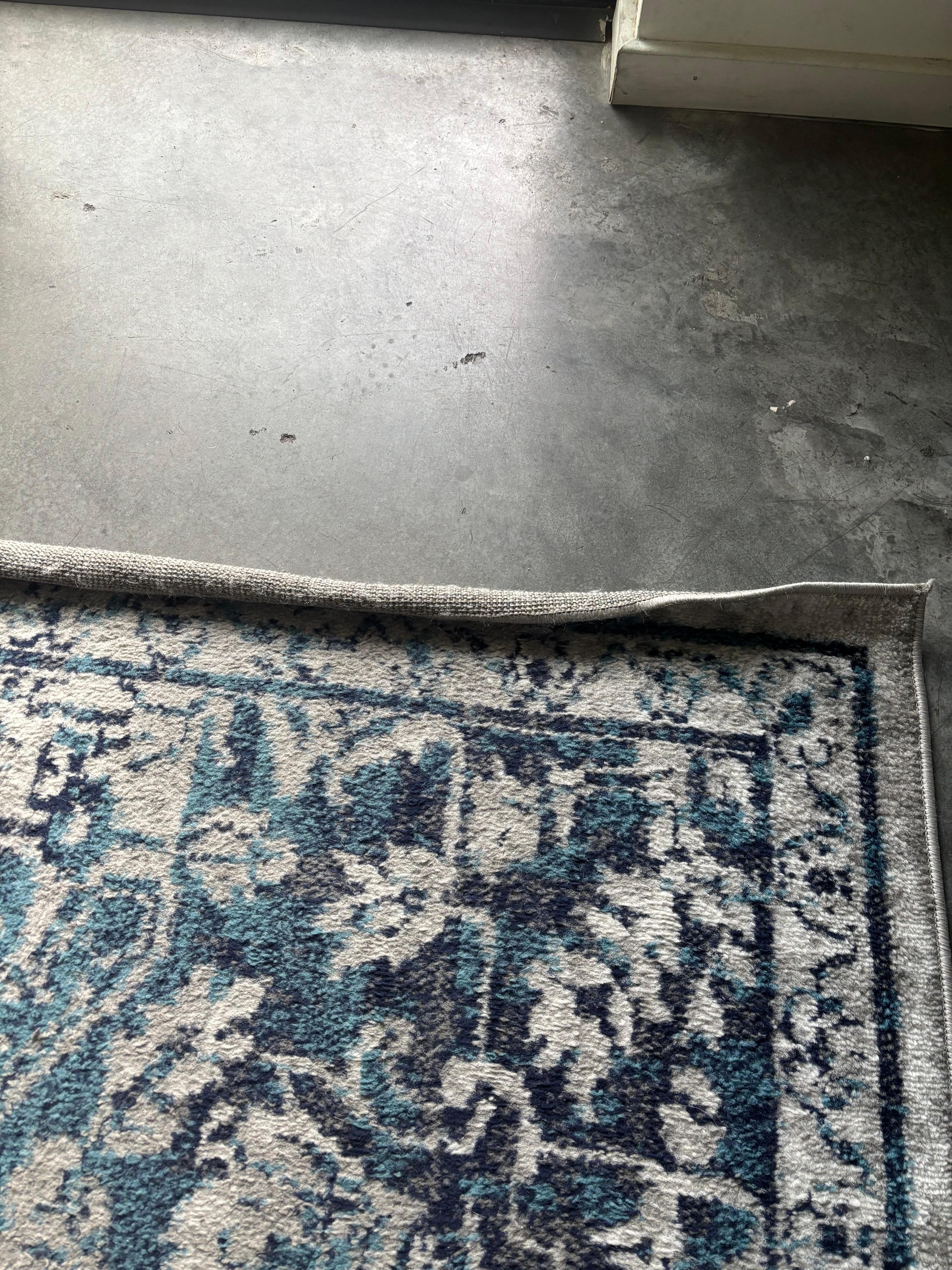 Living room rug -rolled on both ends