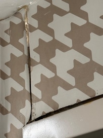 The wallpaper and shower is the area affected by the black mold and mildew. The wallpaper was is noticeably lifted and peppered with black mold. Also the ceiling has evidence of water leakage.