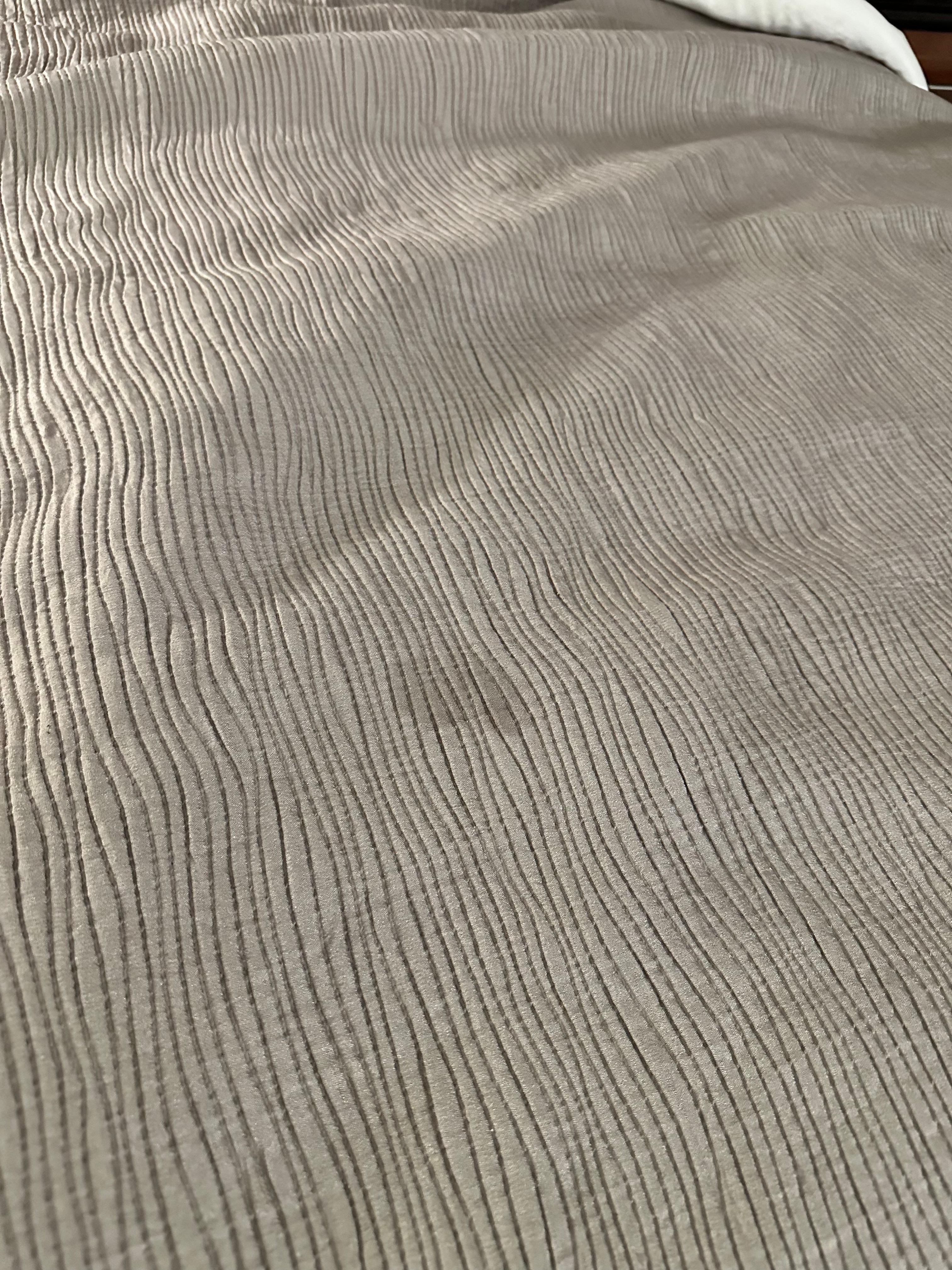 Bedspread with dirty. I always bring my own sheets and this is why