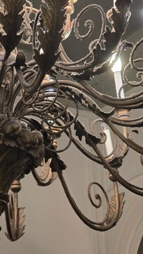 The chandeliers look like they haven’t been dusted in ages