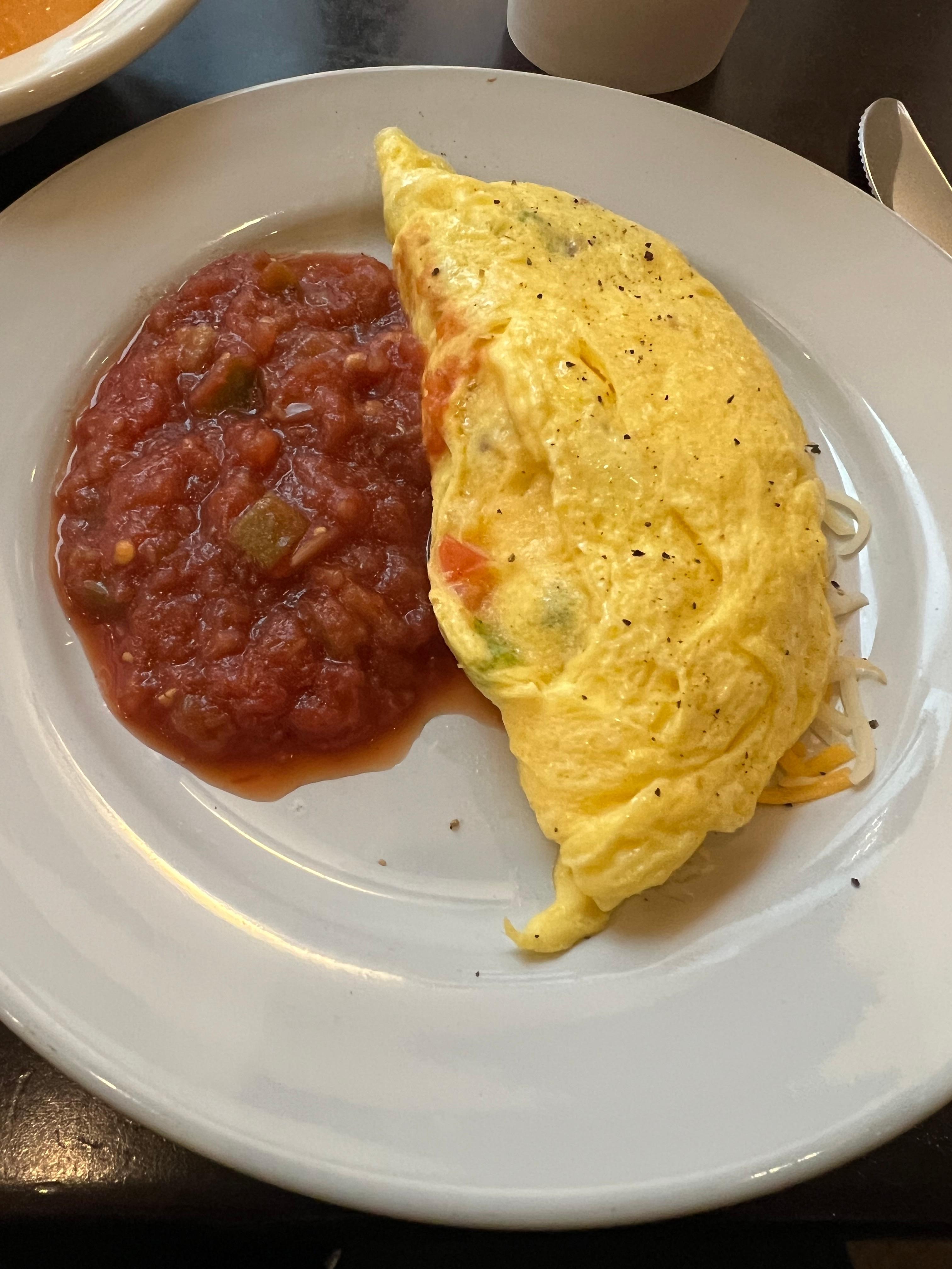 My kind of loaded made-to-order omelet with delicious salsa!