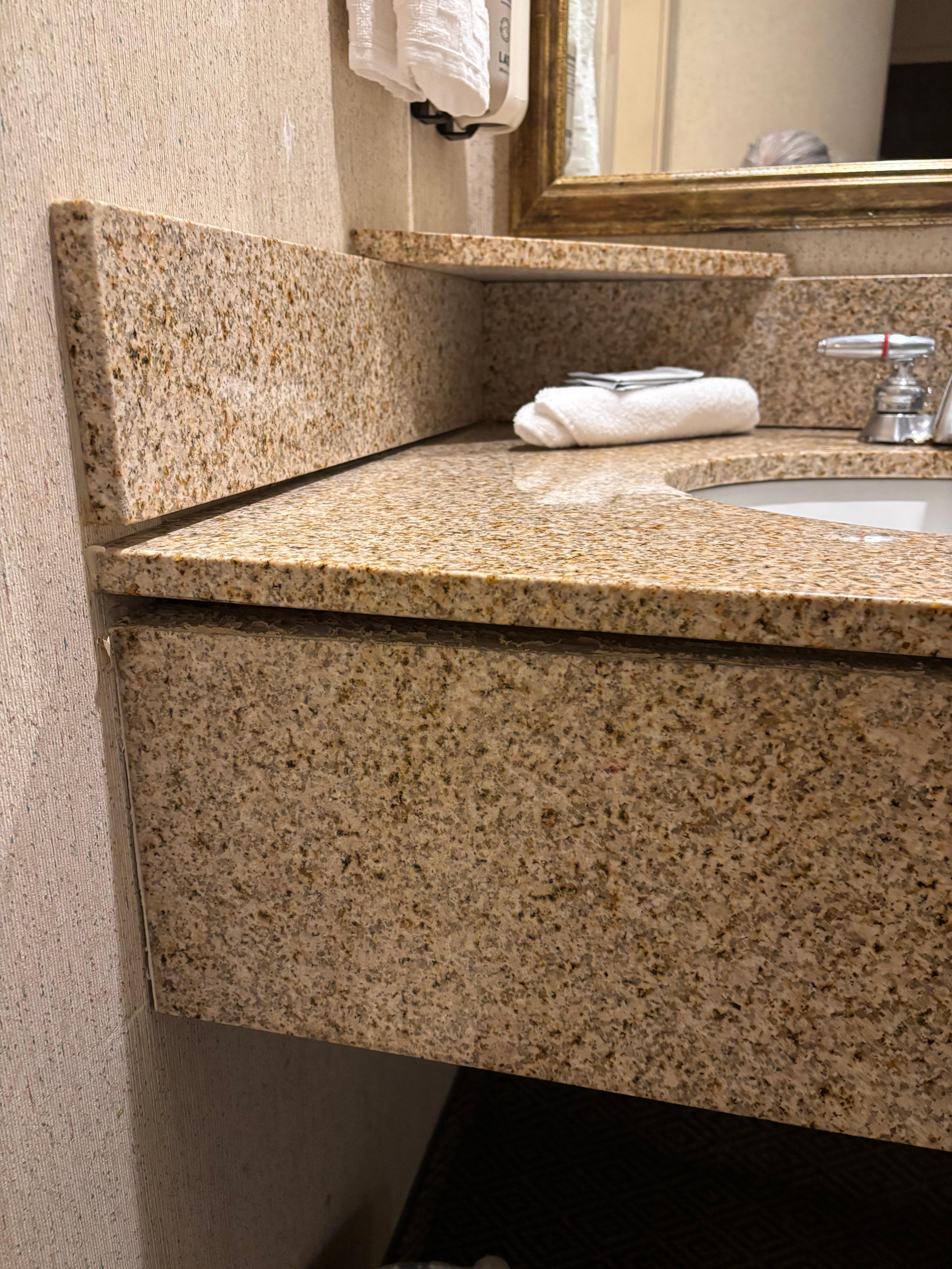 Glue coming apart to the sink area, hope it doesn’t fall.  And shower doors doesn’t close well. 