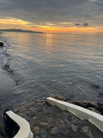 The small sandy beach at high tide