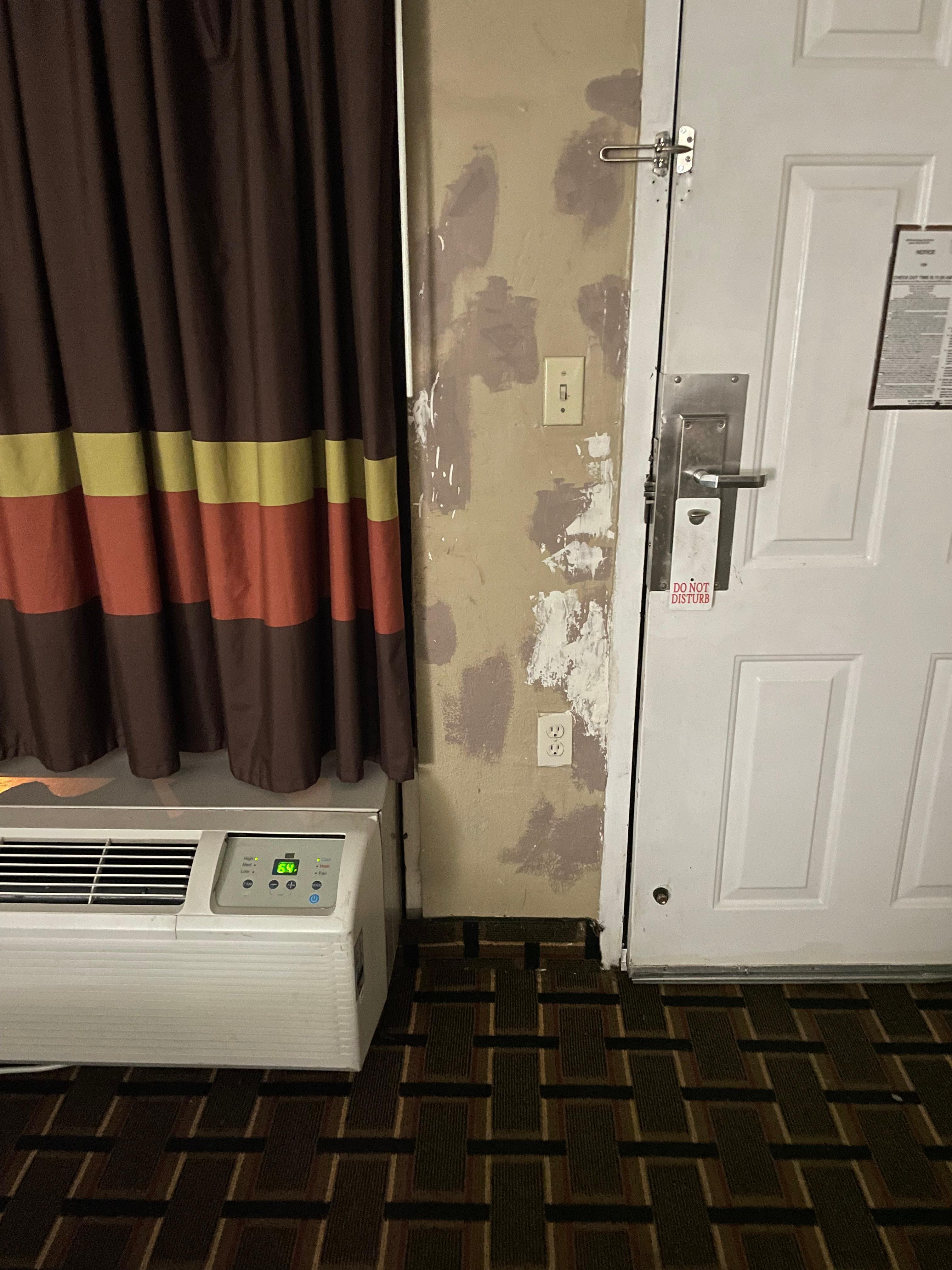 Wall had paint peeling and holes