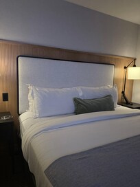 Nice wall, headboard, clean and comfortable bed!