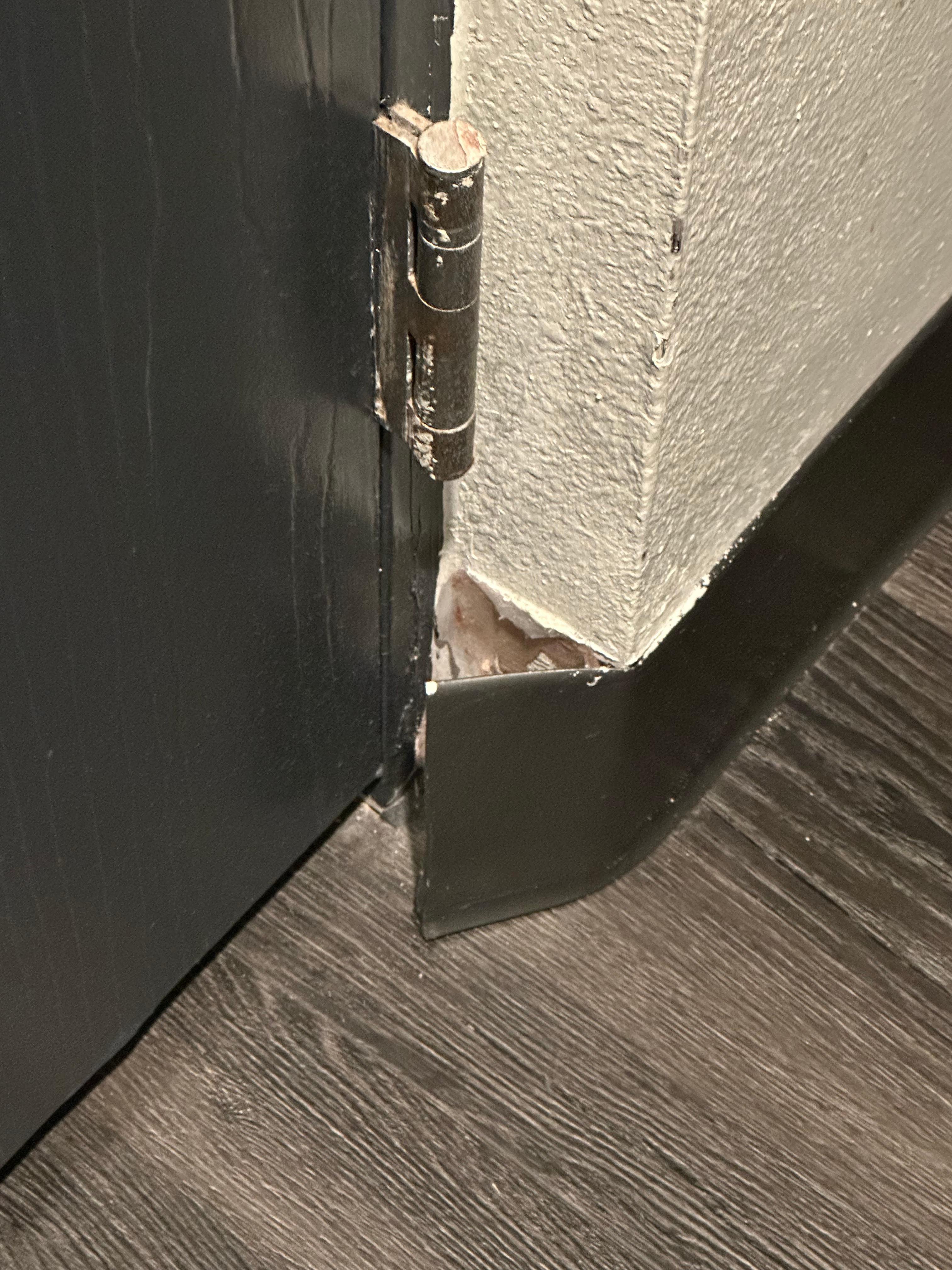 Baseboard that is falling off the wall