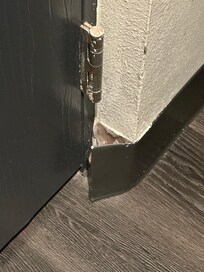 Baseboard that is falling off the wall