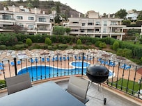 View of communal pool from top floor balcony