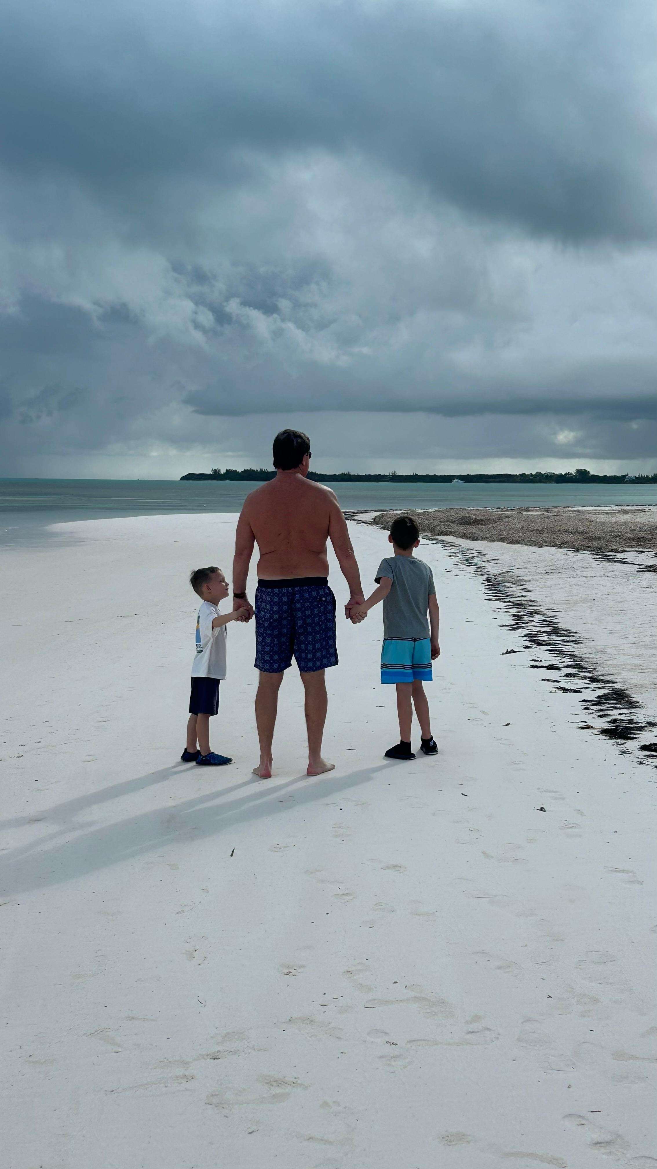 Grandpa and his boys walking the beautiful beach