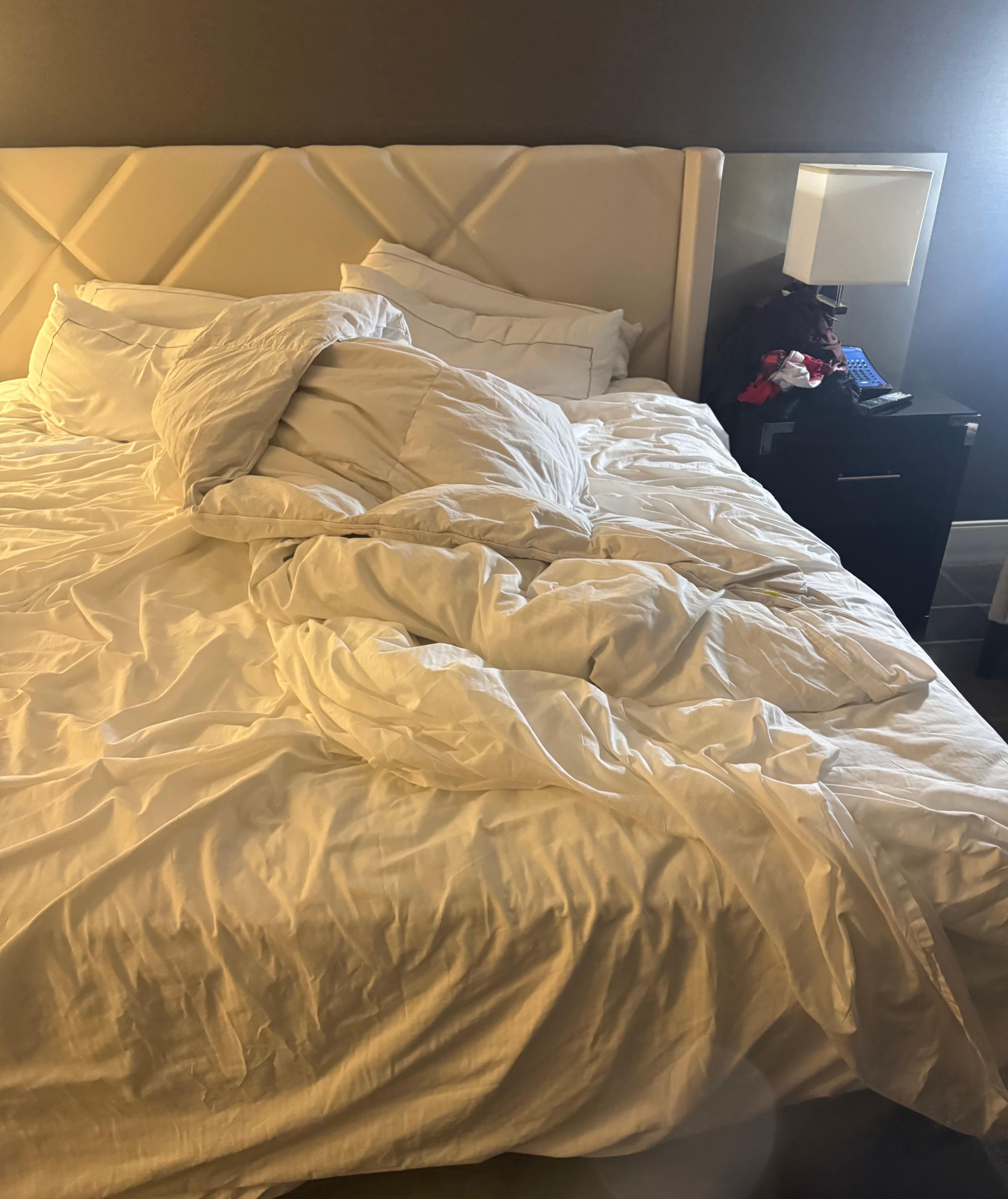 Unmade bed for three day stay