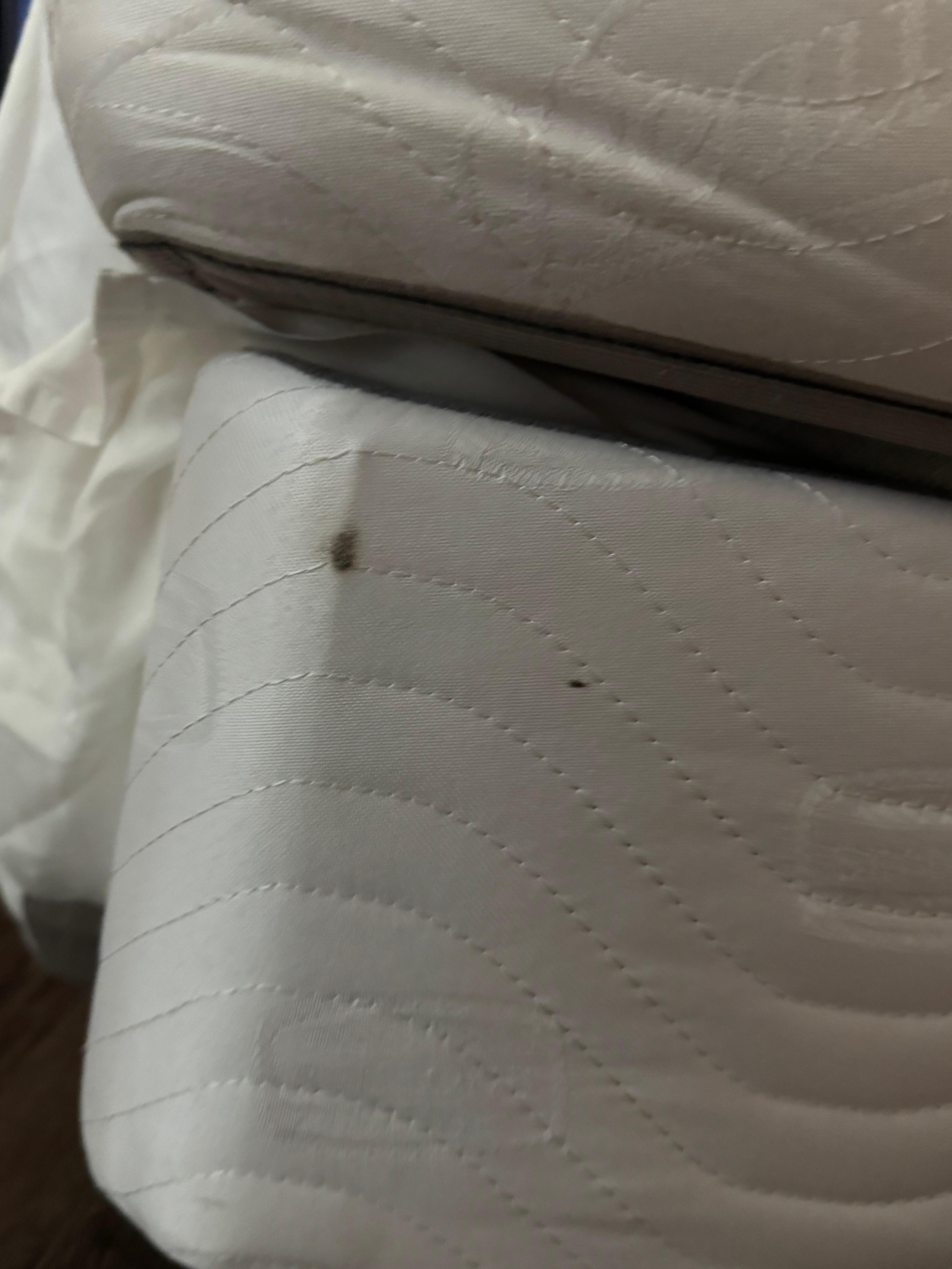 On the side of the bed 