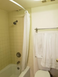 Ceiling in bathroom along with dirty towels
