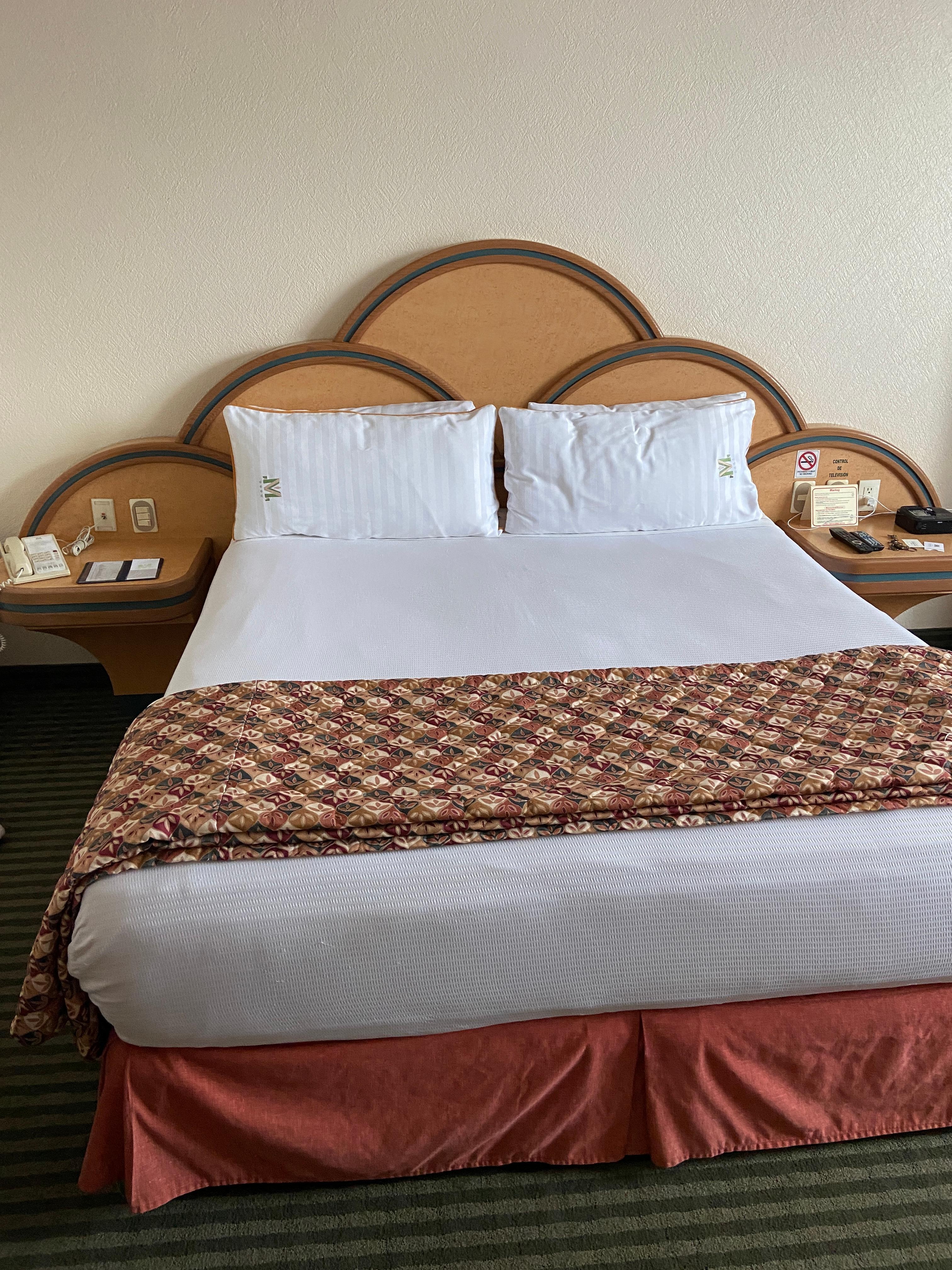 Bed made while gone. Had luggage on bed