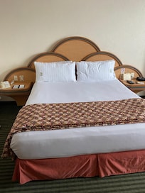 Bed made while gone. Had luggage on bed