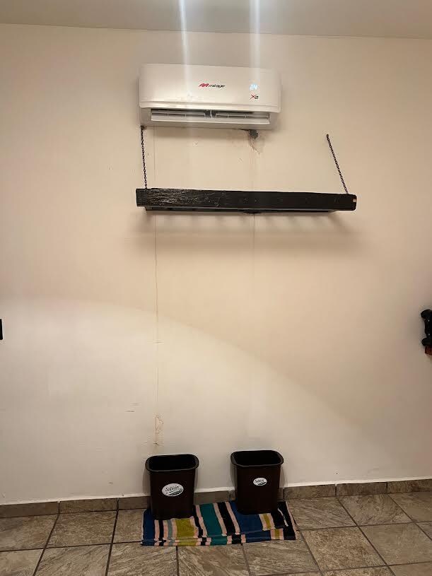 AC unit- with buckets under catching dripping water